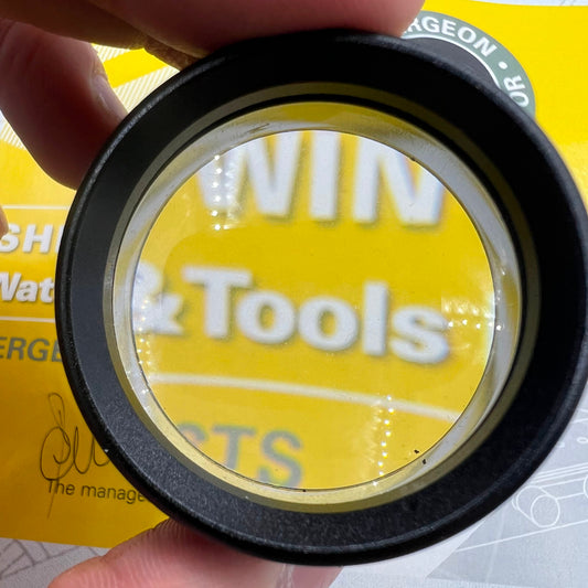 Black 30X magnifier loupe, ideal for precise watch repair and jewelry crafting.