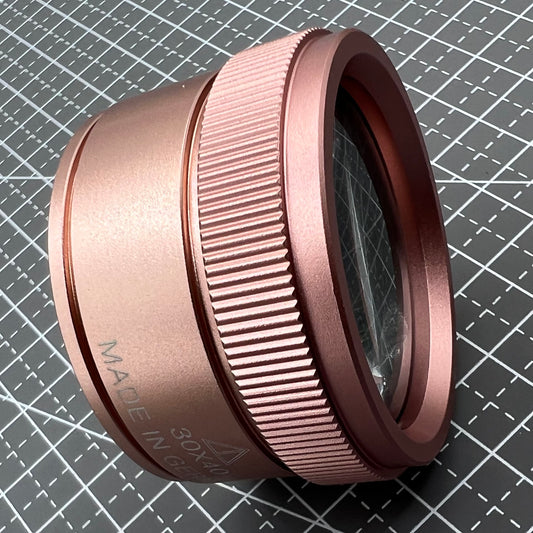Rose gold 30X magnifier loupe by Germany Made, ideal for detailed watch and jewelry repair tasks.