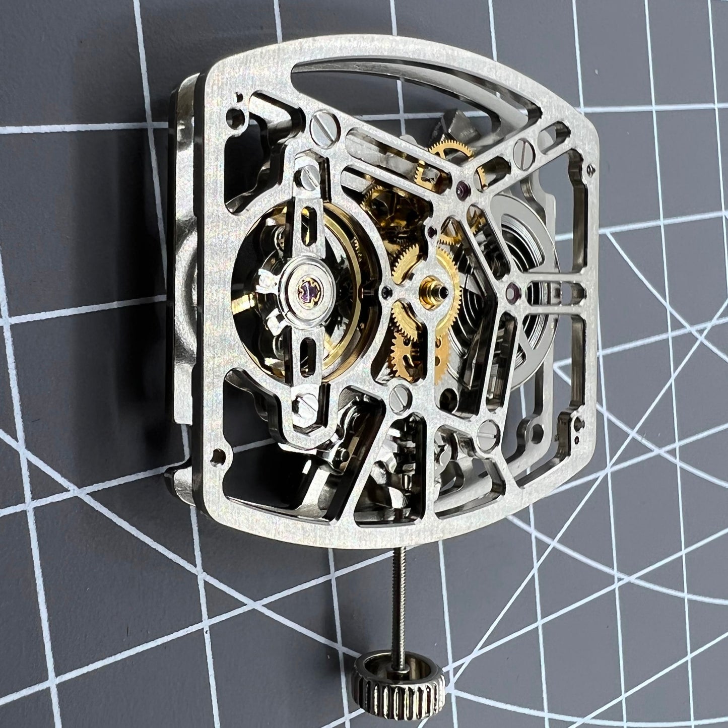 Silver barrel-shaped automatic watch, Asian precision movement for watch enthusiasts.