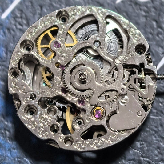 Silver hollow mechanical watch movement with rose gold rotor, China-made, ideal for watch repairs and upgrades.