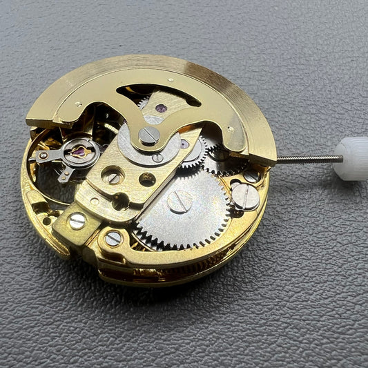 Golden 26.5mm hollow carved watch accessory with automatic 7120 mechanical movement, precision-engineered.