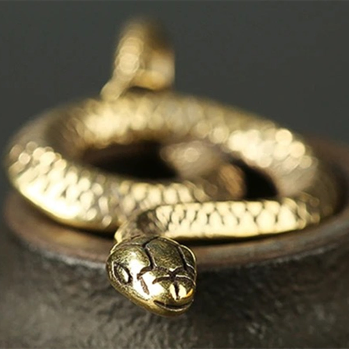 Hand carved vintage bronze snake figurine in solid copper with intricate details, perfect for watch accessory decor.