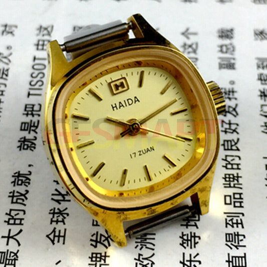 HAIDA Manual mechanical lady watch with yellow dial, square case, golden nail markers, 17 jewels, elegant design.