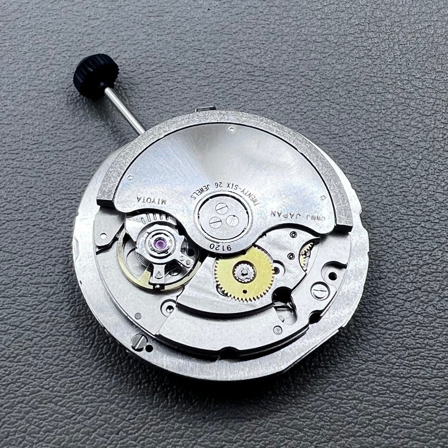 Close-up of Japan Miyota 9120 automatic mechanical watch movement showcasing precision craftsmanship.