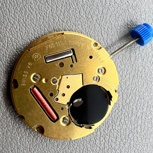 Swiss ETA F05.111 quartz watch movement with 2 hands, date at 6, black dial, precision timing.