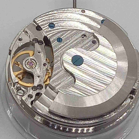 Silver hollow watch accessory showcasing a mechanical movement with a large 12 o'clock flywheel, China made.