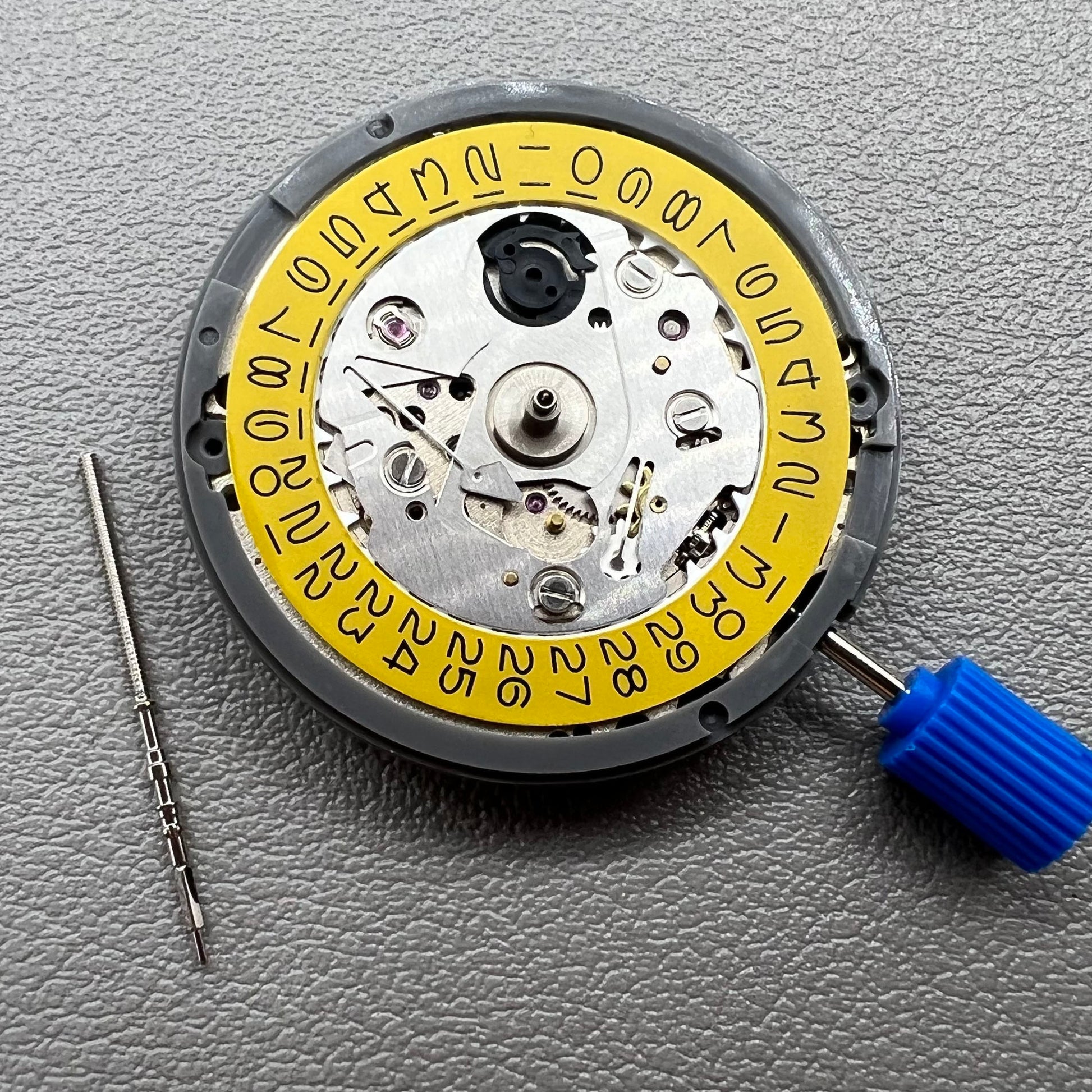 Seiko NH35 automatic watch movement with dark yellow disk, precise mechanical timekeeping by Japan.