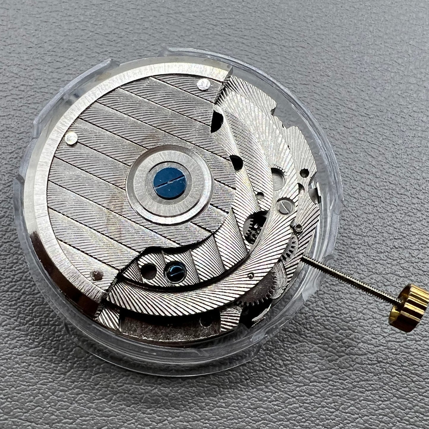 Wenzhou Mechanical watch movement with bare balance wheel and big date display at 12 o'clock.