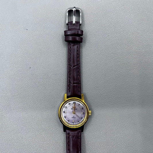 Dark Brown Strap Round Case 3 Hands Purple Background Manual Mechanical Watch