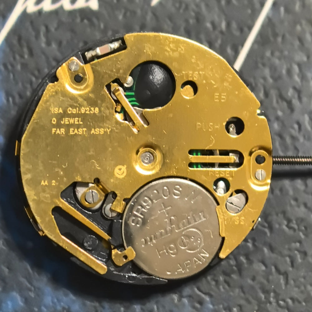 Swiss ISA9238 golden multifunctional quartz watch part with six hands for precise timekeeping.