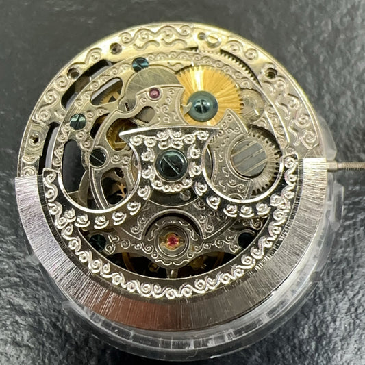 Silver hollow watch with China-made Liaocheng automatic mechanical movement, small second dial at 6 o?clock, branded design.