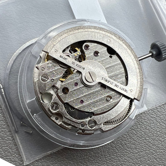 Japan Miyota 8218 automatic watch movement with date at 9 o'clock and two hands, precision timekeeping.