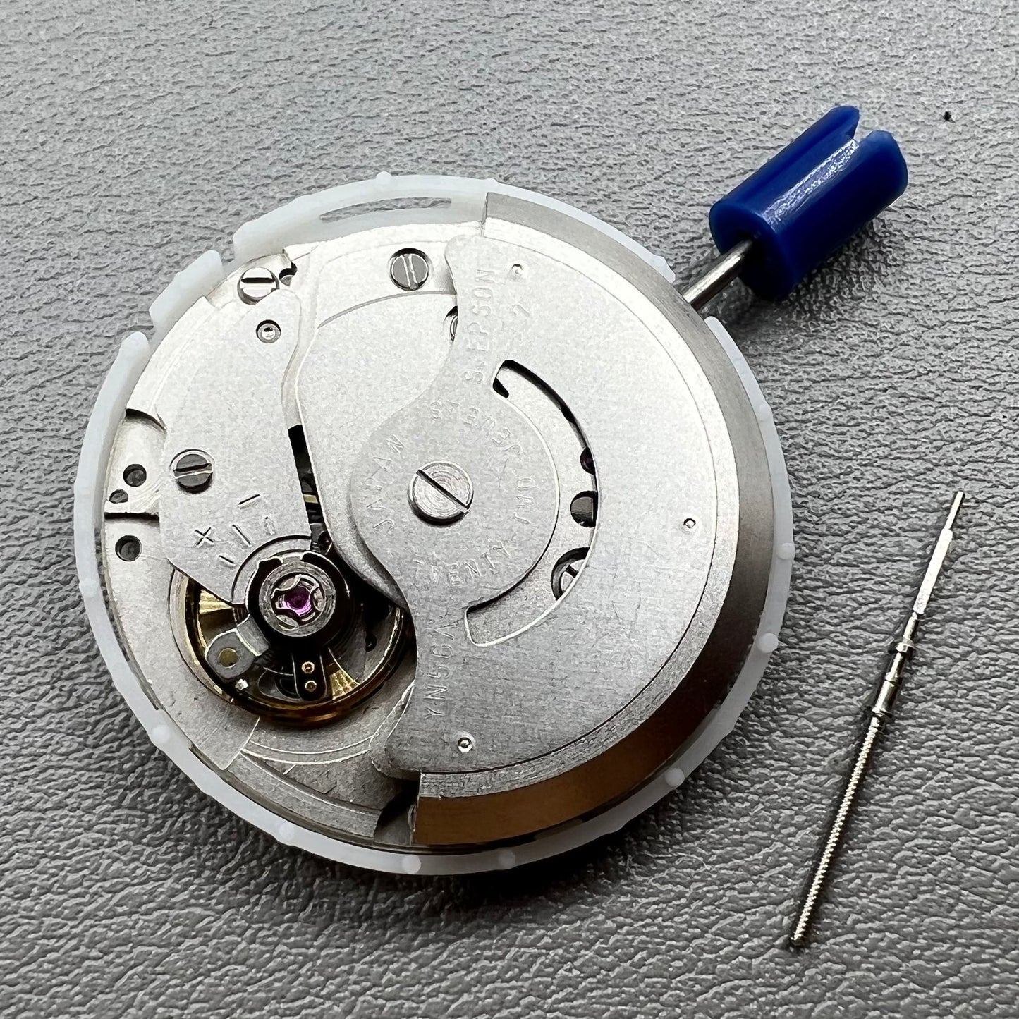 Japan Epson YN56 mechanical watch movement showing date and day functions.