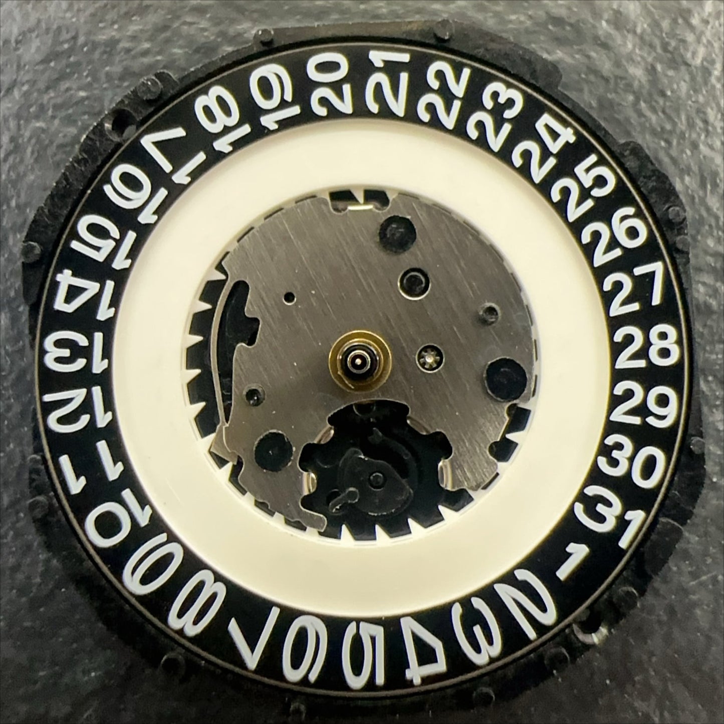 PC32A quartz watch movement with single calendar, black date disk at 3 o'clock by Japan Made brand.