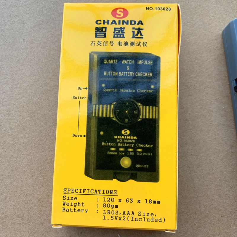 QBC-22 Quartz tester, compact diagnostic tool for watch battery and movement testing.