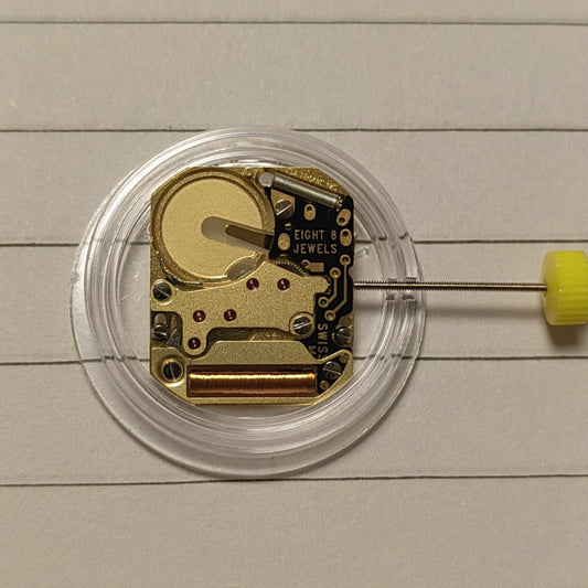 ISA 125 golden quartz movement with stem for precise watch repair and assembly by Watchmakers.