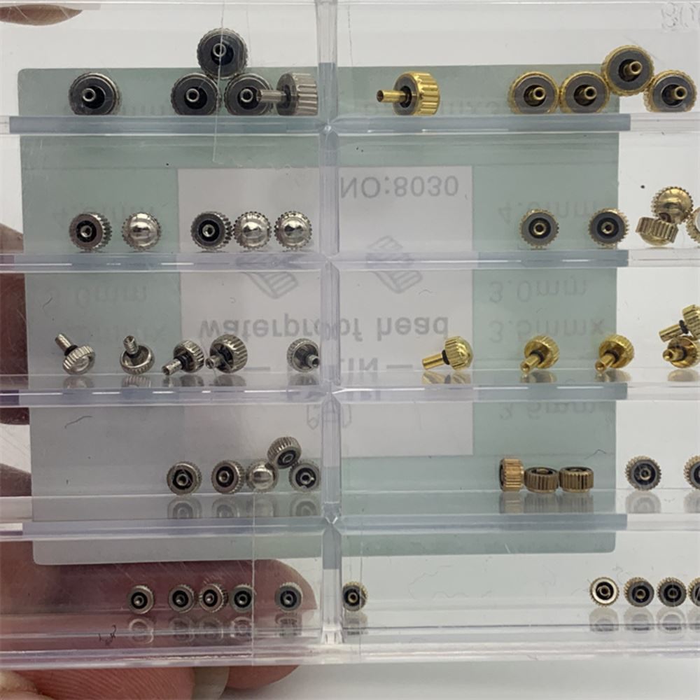 Assortment of stainless steel waterproof watch crowns for precise repairs.