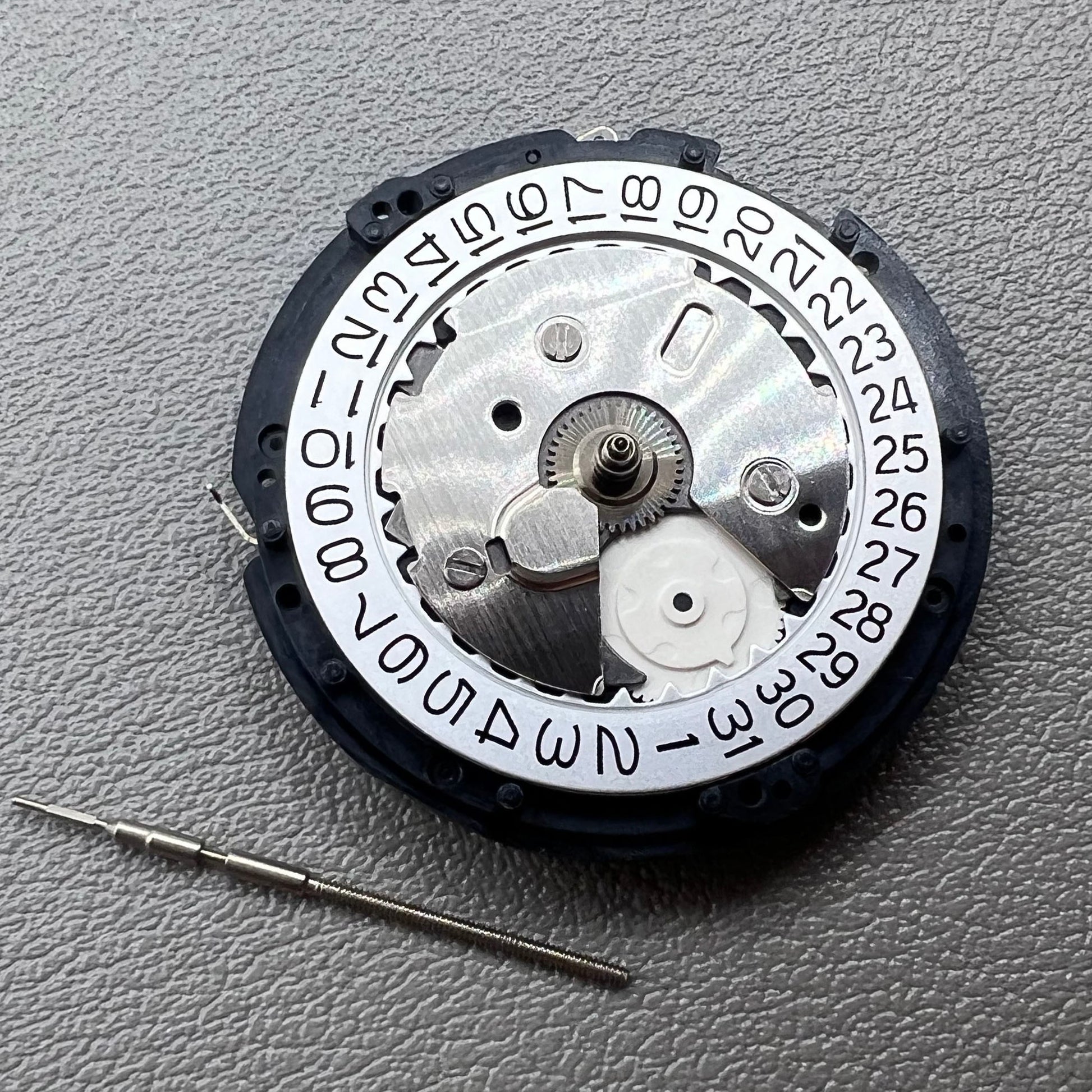 Original Japan Seiko 5M85A watch movement close-up, precise quartz mechanism for durable timekeeping.