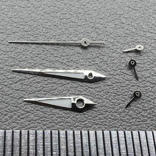 Set of 2 silver-trimmed green lume arrow-shaped watch hands for VX3J, VX9J, VX7J, VX3N, VX9N movements.