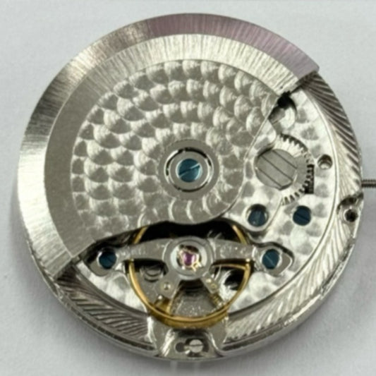 Shanghai Made silver watch with mechanical movement, black dial, and quick date adjustment features.