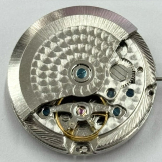 Shanghai Made silver watch movement with black disk and quick adjustment, showcasing mechanical 3 hands design.