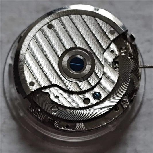 Wenzhou mechanical watch with big date at 12, bare balance wheel at 6, Chinese craftsmanship.