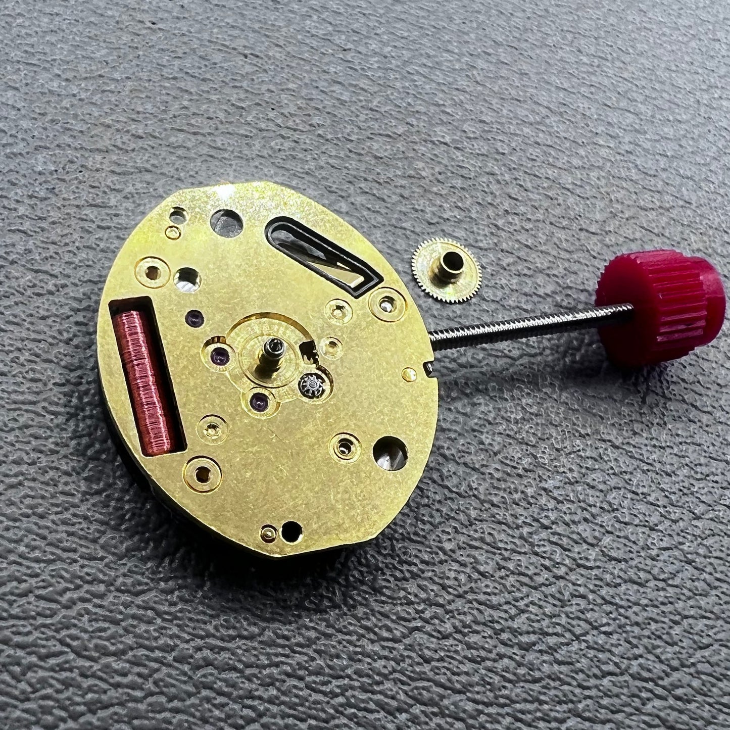 Close-up of Swiss ETA 980.103 quartz watch movement showcasing precision engineering and reliability.