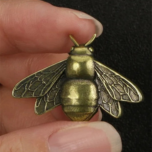 Solid copper vintage bee trinket with hand-carved details, perfect for rustic decor.