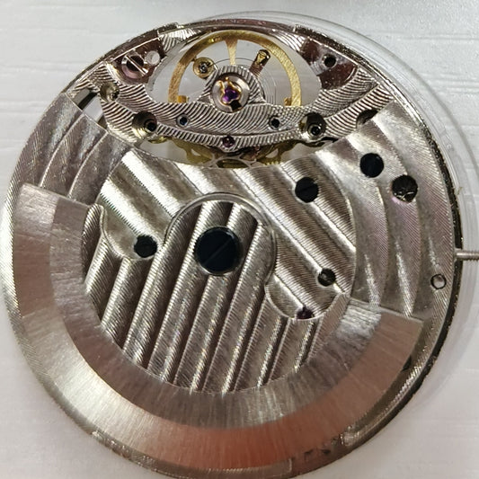 Silver hollow mechanical watch accessory with big flywheel and moonphase at 12, China-made craftsmanship.