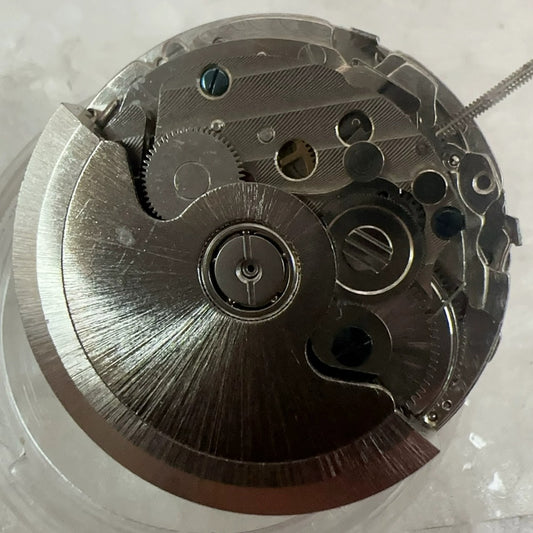 Shanghai Mechanical Movement watch with big date, small seconds at 3, 6, and 9 o'clock, elegant design.