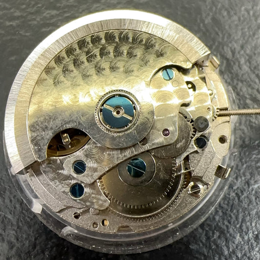 China Made multifunctional watch with mechanical movement, moon phase at 6 o'clock, week disk at 12, elegant design.