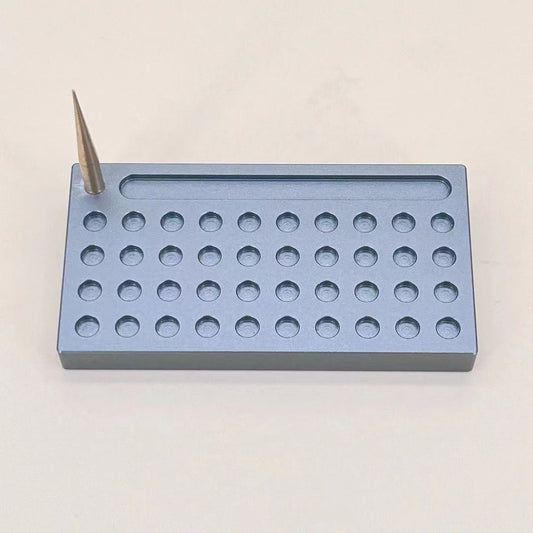 Watchmaker balance hairspring holder stand by Tack for precise watch repair tasks.