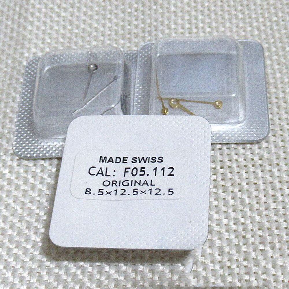 Silver watch hands set for F05.112 movement, includes hour, minute, and second hands.