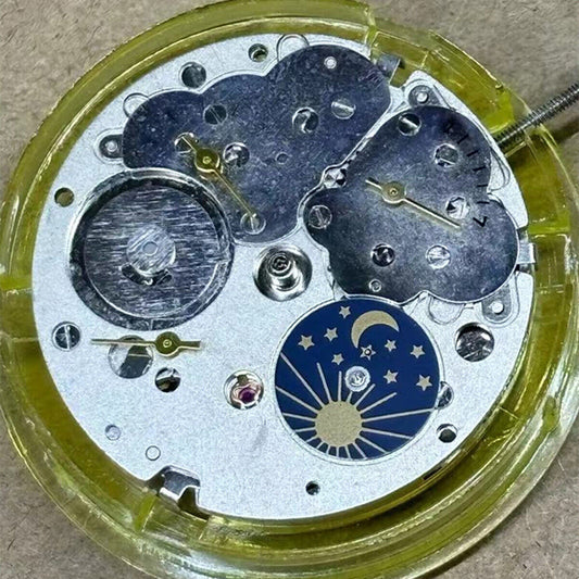 Mingzhu 2813 automatic watch movement showing moon star phase at 6 o'clock position with precision craftsmanship.