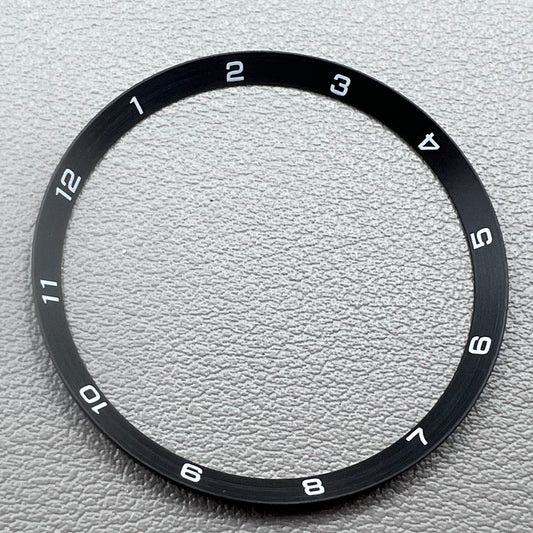 Black stainless steel chapter ring 34.9mm x 31.0mm x 1.9mm for watch accessory.