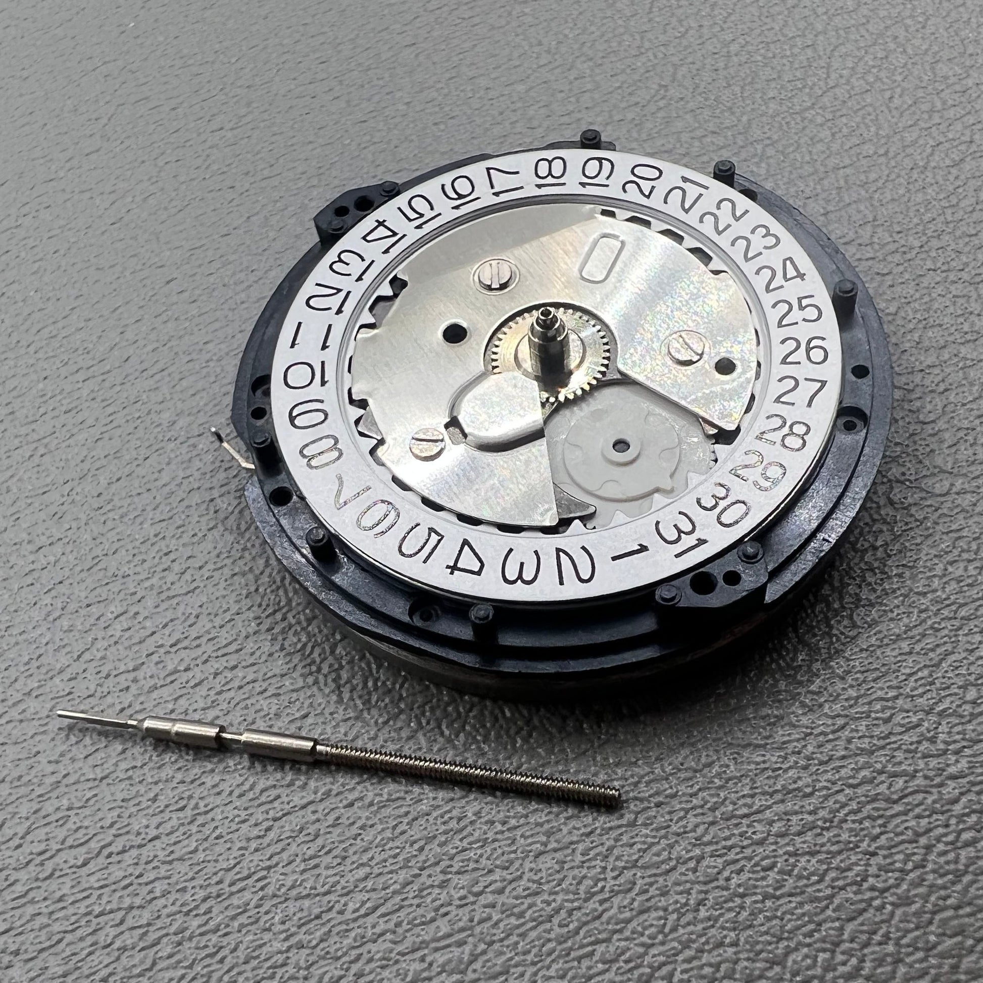 Seiko 5M85A quartz watch movement close-up, original Japanese precision mechanism for reliable timekeeping.