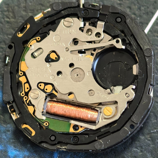 Citizen Eco-Drive E110 solar watch movement with date display at 3 o'clock for precise timekeeping