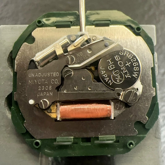 Miyota 2305 quartz watch movement with black day-date disk, Japanese precision for watch repair.