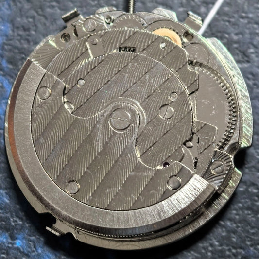 Silver mechanical watch part with small second hand at 3, 9, and 12 o'clock - China Made.