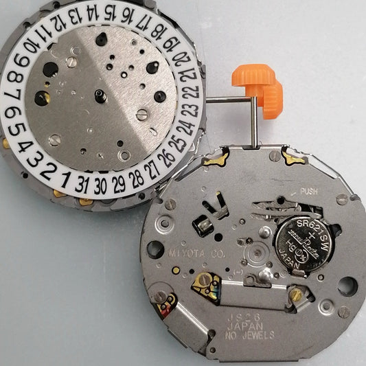Japan Made Miyota JS26 quartz watch movement showing small second subdials at 3, 6, and 9 o'clock positions.