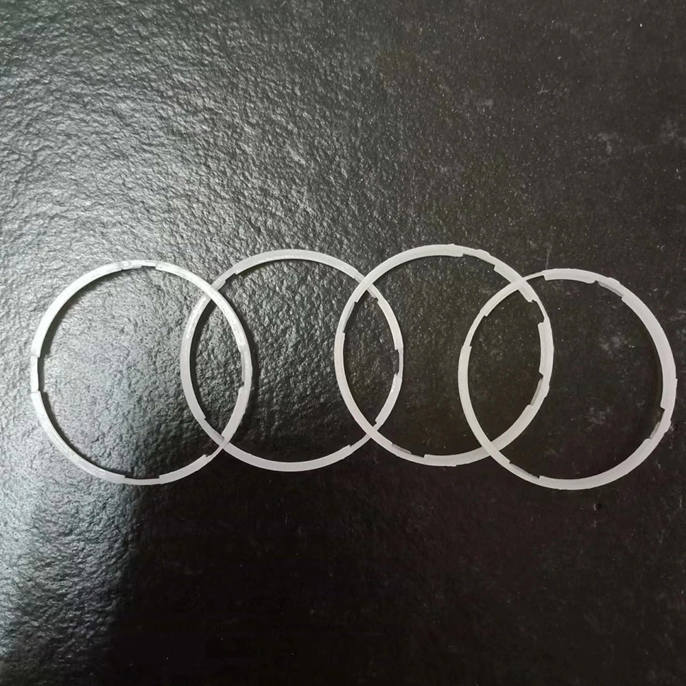 Set of 2 Seiko 7009A plastic watch movement spacer rings, 29x1.6mm, for precise watch repairs.