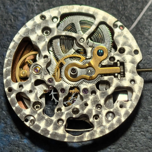 Hollow Hangzhou 2189 automatic watch movement with red rotor and three hands, China made for precision.