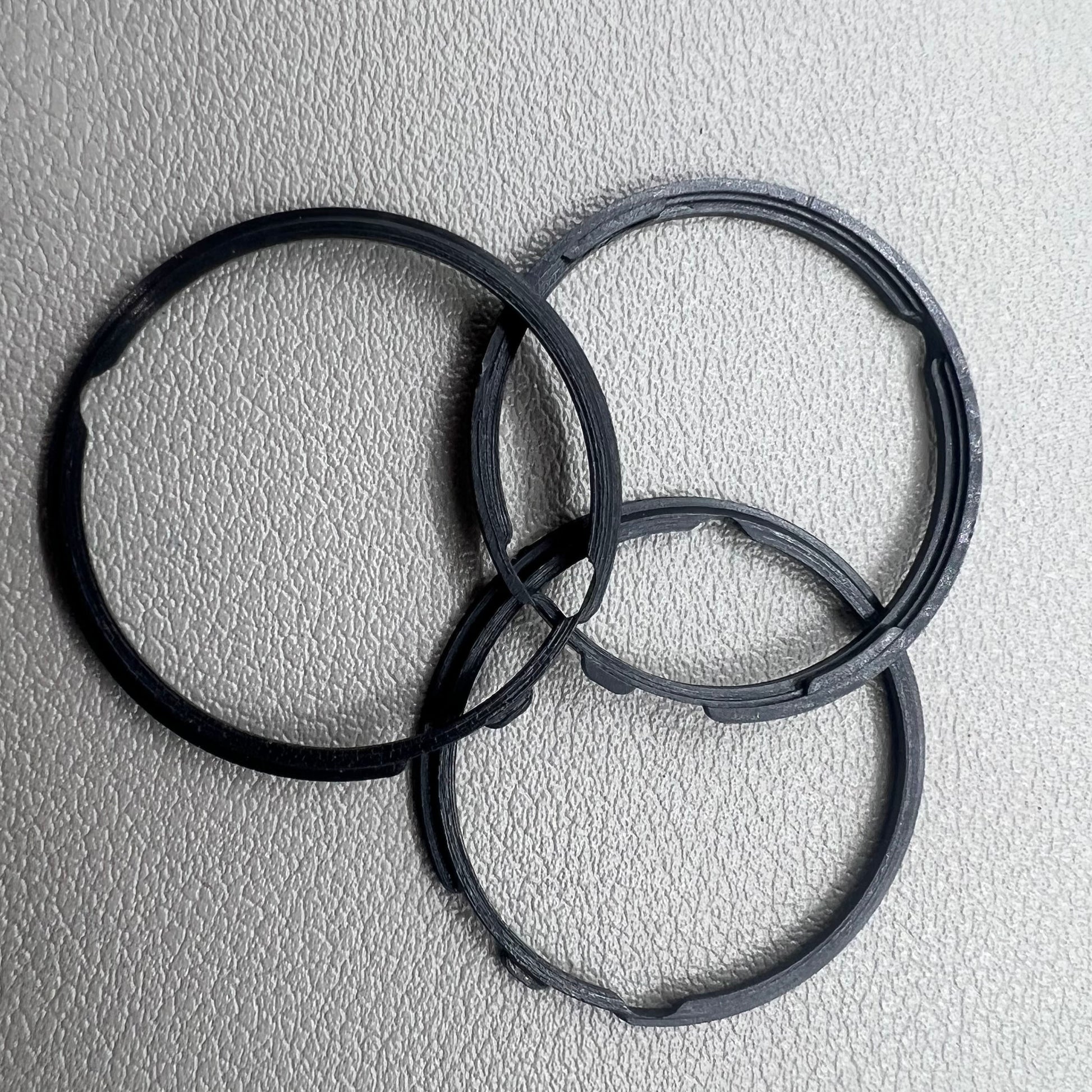 Set of 5 black cushion mount spacer rings by Orient for 46941 watch movement adjustment