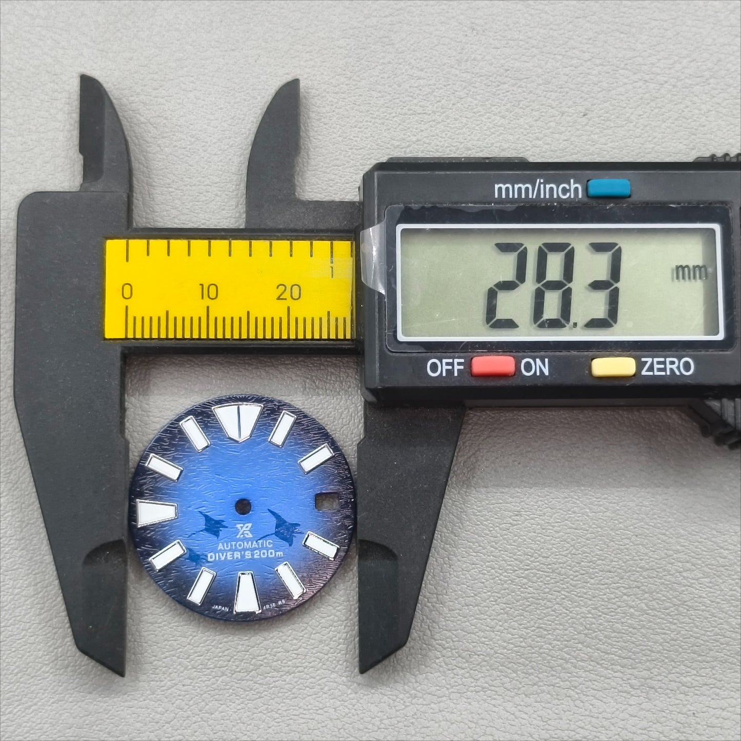 watch dial with S logo