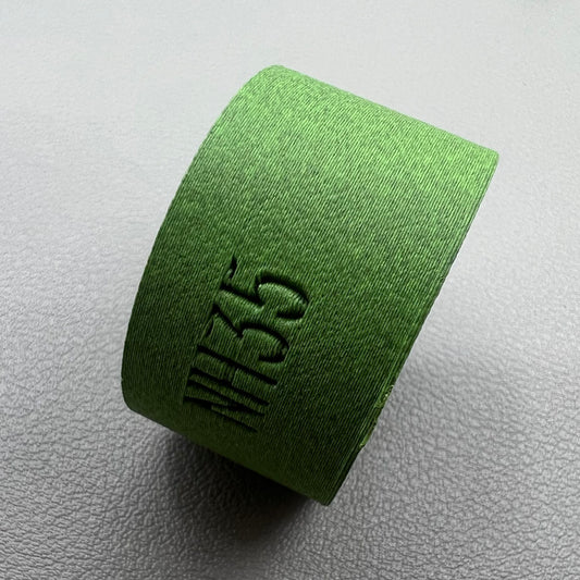 Watch movement holder securely holding Seiko NH35 movement for precise assembly and repair.