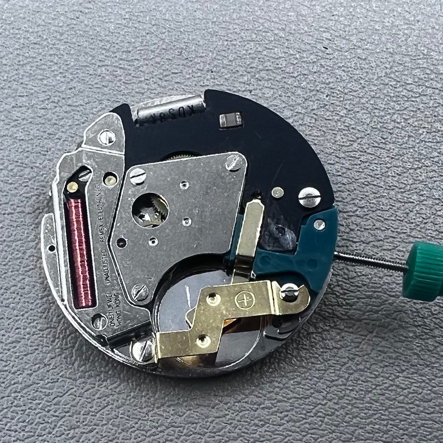 Swiss ETA 6640B quartz watch movement with 3 hands and black circuit board for precise timekeeping.