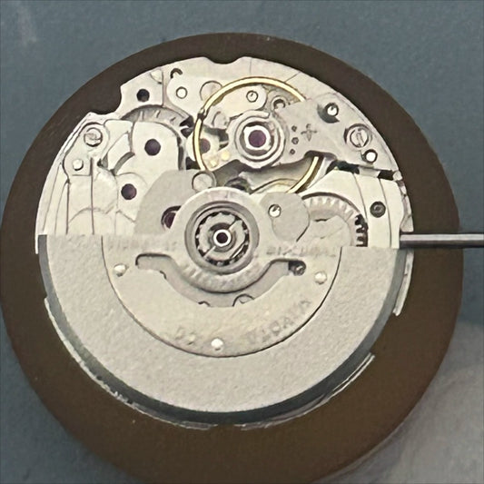 Miyota 6T15 mechanical watch movement with date at 3, precision Japan-made component for watch repair.
