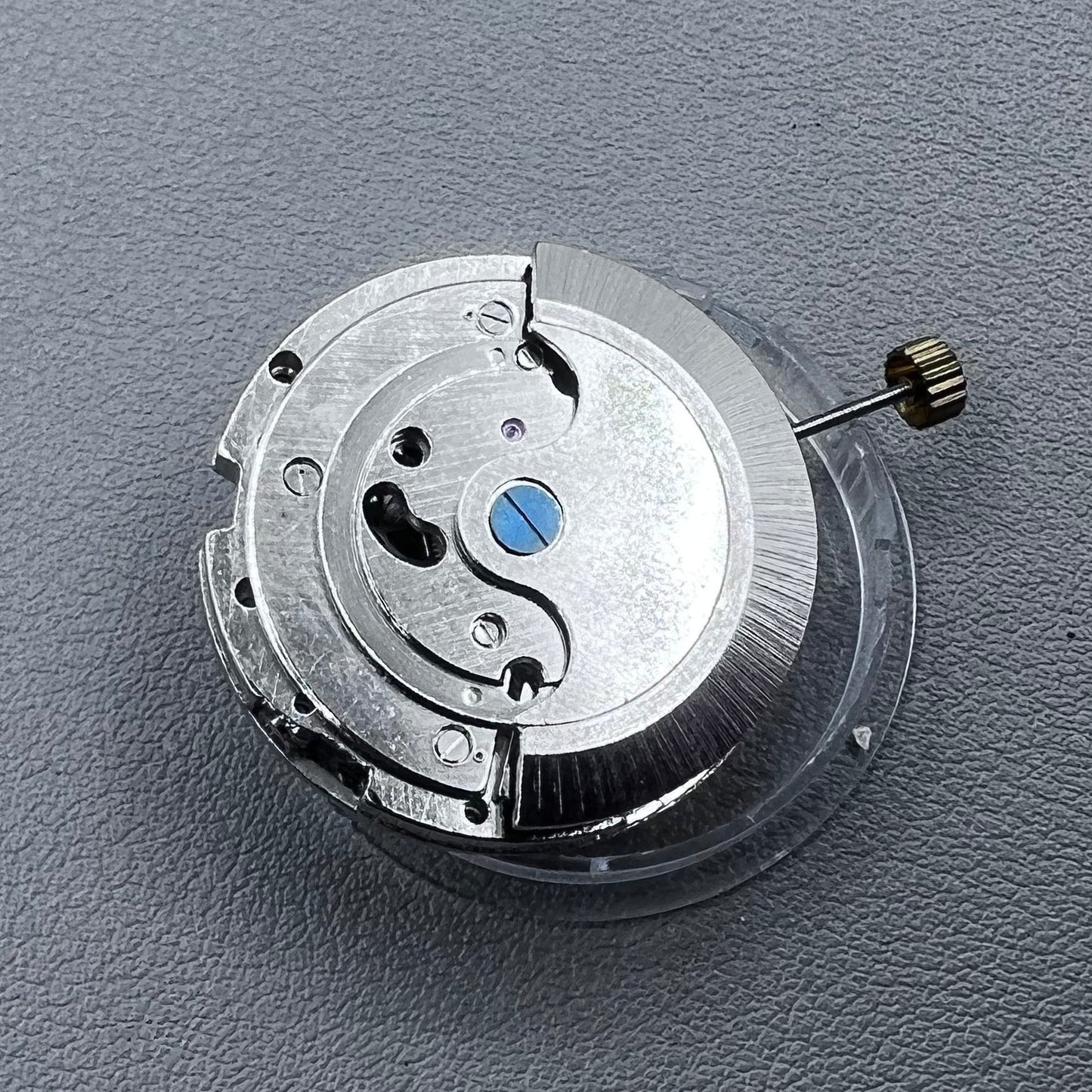 China multifunctional automatic watch with mechanical movement, moon phase at 12 o?clock, and visible flywheel detail