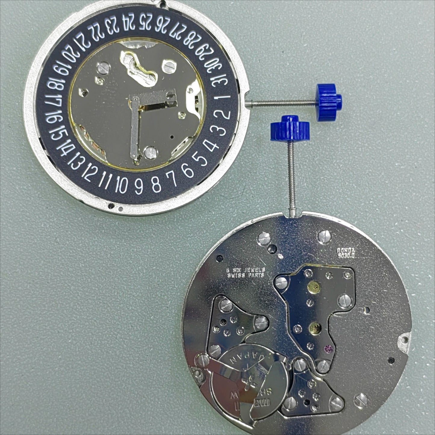 Swiss Part Ronda 5030.D quartz watch movement with black date disk at 6 o'clock for precise timekeeping