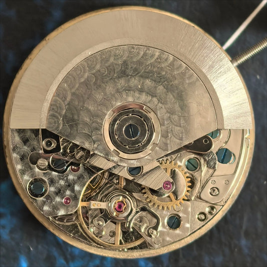 Dandong 7750 mechanical watch movement with double calendar and small second at 9 o'clock - precision craftsmanship.